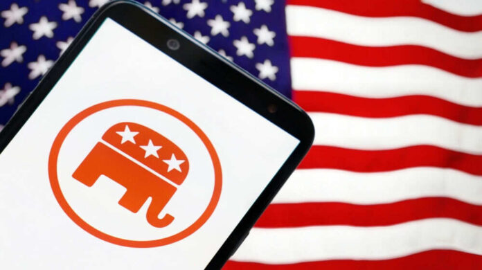 2429057009 Smartphone displaying red elephant GOP logo USA flag