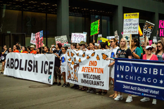 1451785748 Protesters with banners advocating immigration reform