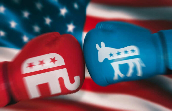 shutterstock_2220552921 Red and blue boxing gloves with political symbols