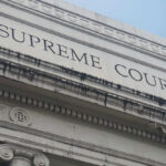 $9 BILLION FRAUD SCHEME Rocks Minnesota Building facade with Supreme Court signage visible