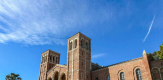 Brick building with arched windows and blue sky