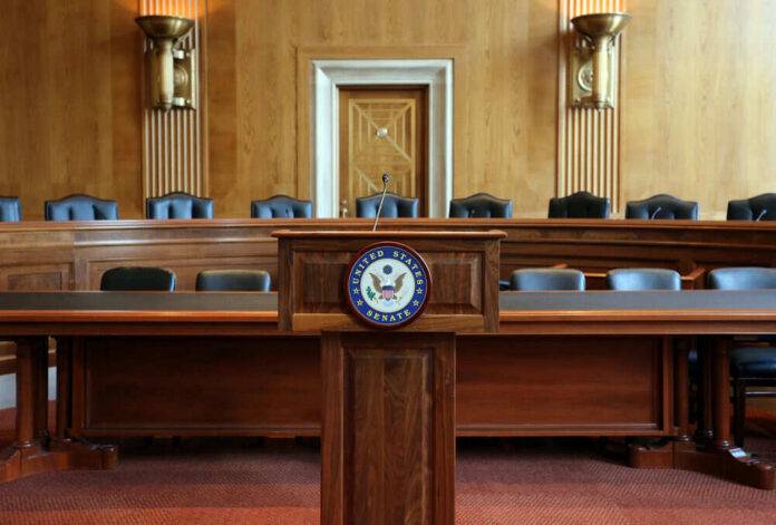 United States Senate hearing room with empty chairs