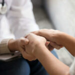 New Brain Death Pathway Shocks Alzheimer’s Field Doctor holding patients hands comforting them